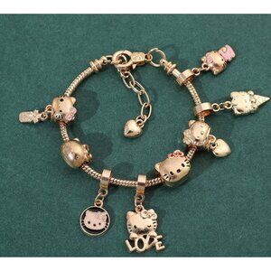 Hello Kitty Gold-Tone Charm Bracelet – Love, Ice Cream & Heart Charms